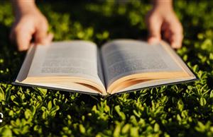 open book being held